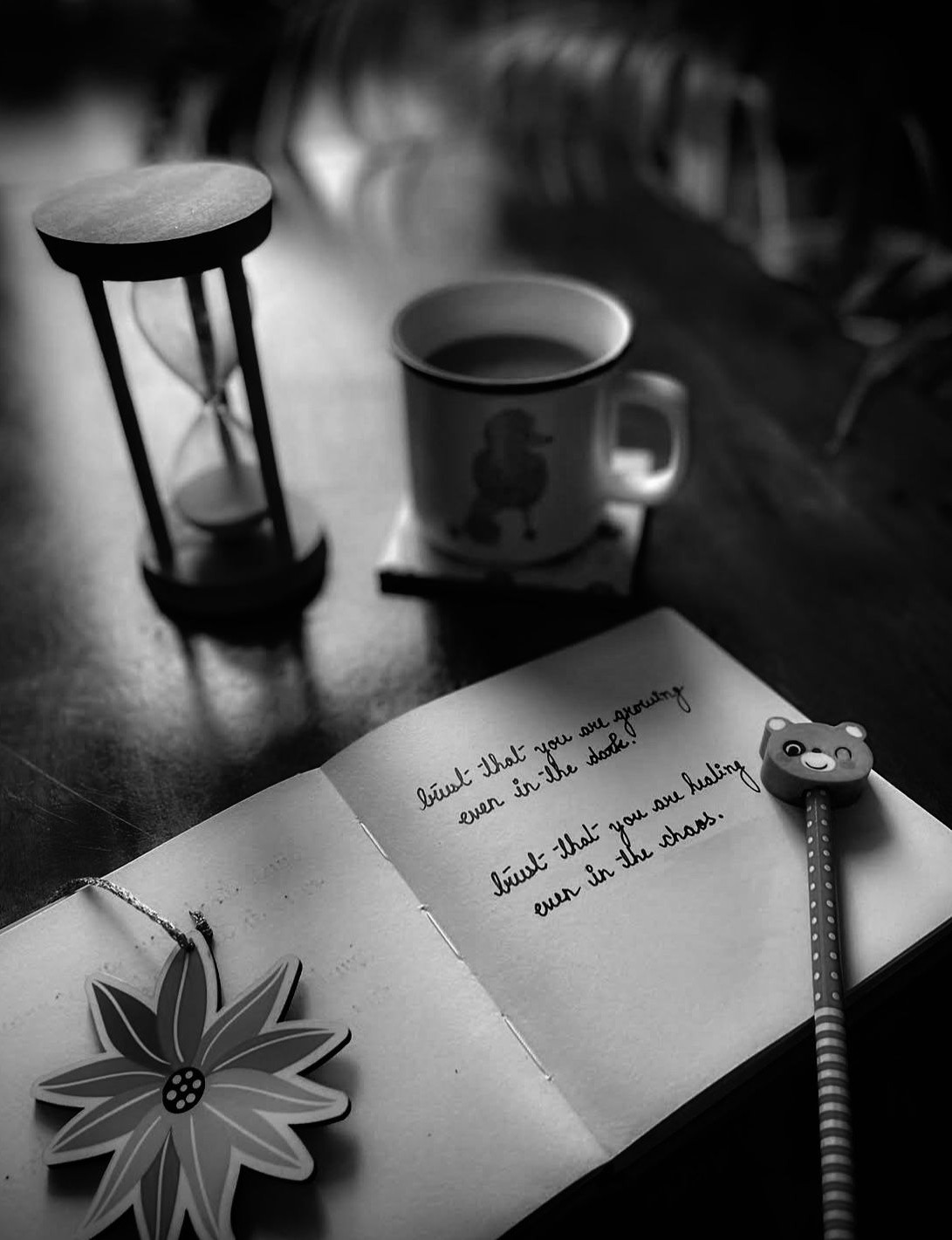 Person writing symbolizing creativity and reflection